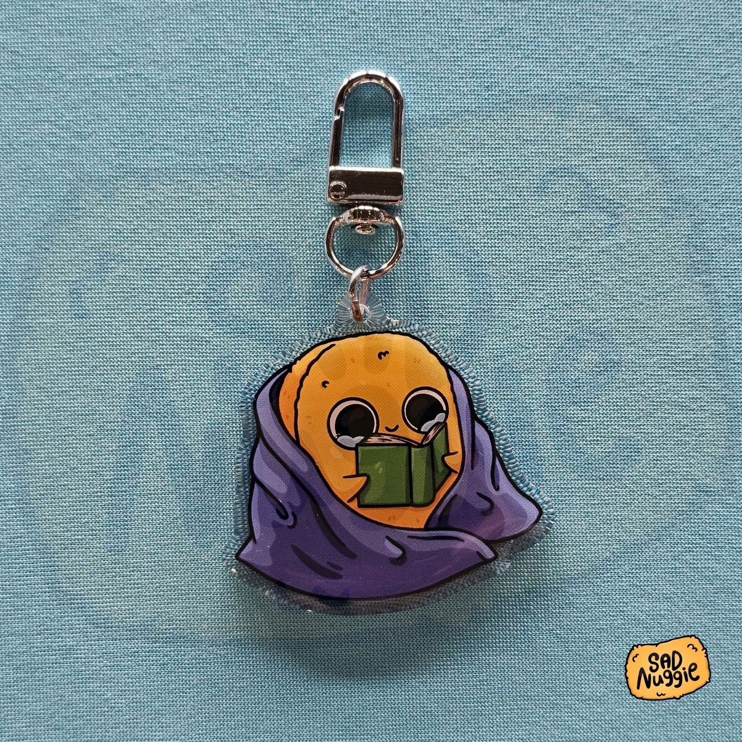 Sad Nuggie Reading Epoxy Keychain