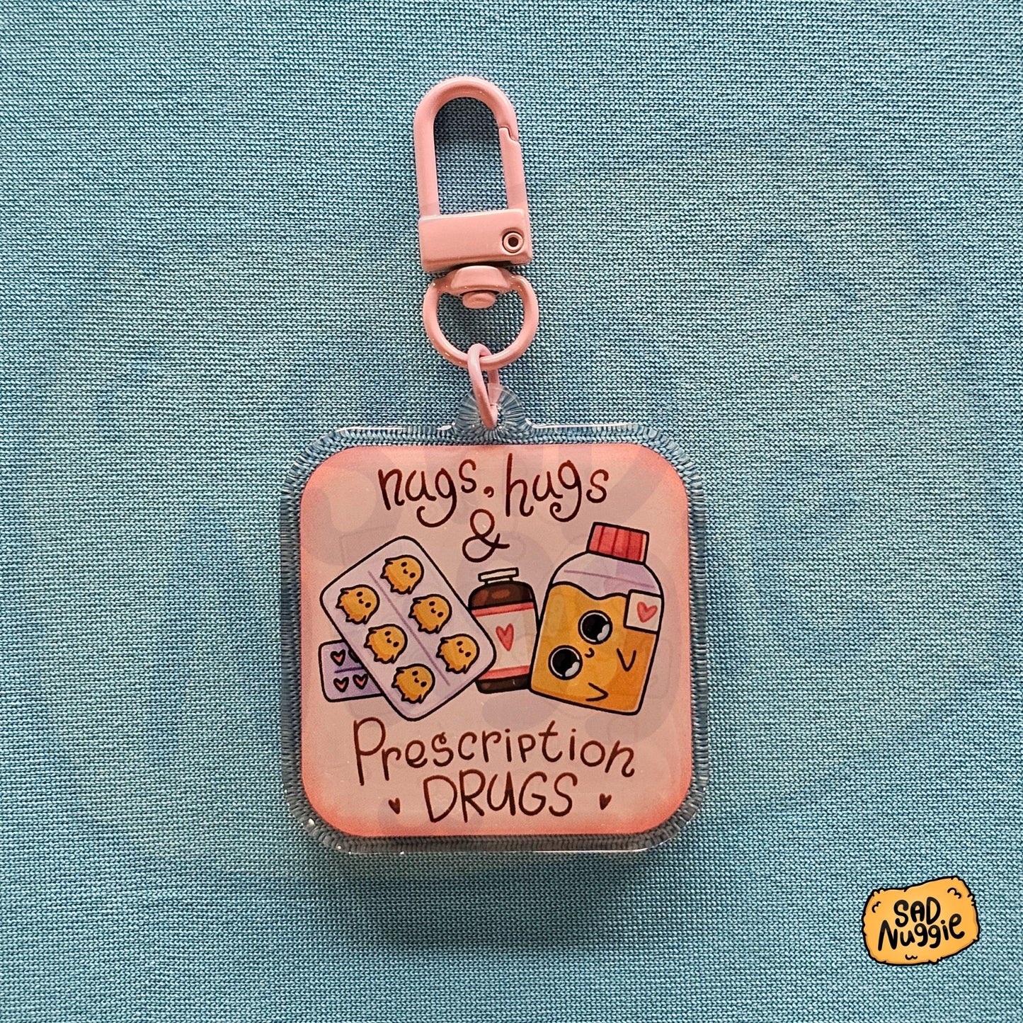 Sad Nuggie Nugs, Hugs, & Prescription Drugs Epoxy Keychain