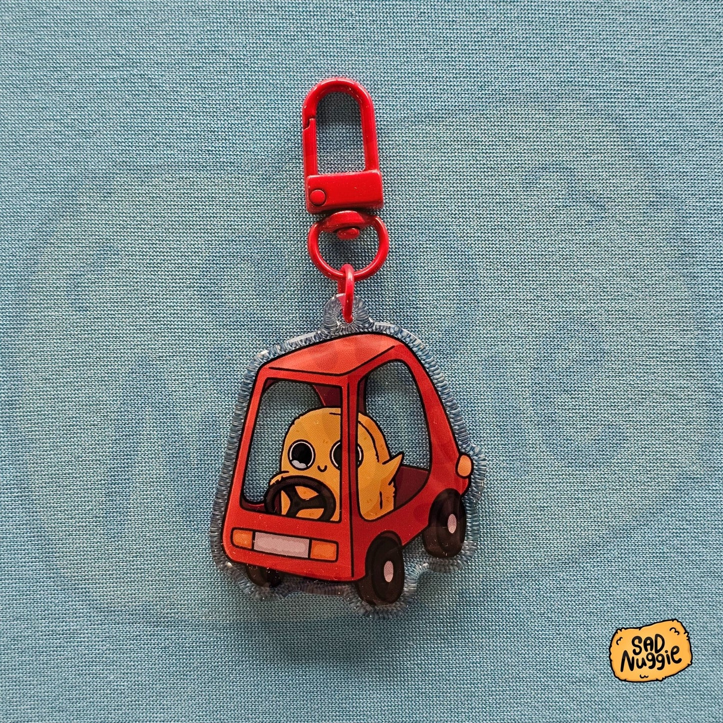 Sad Nuggie Little Car Epoxy Keychain